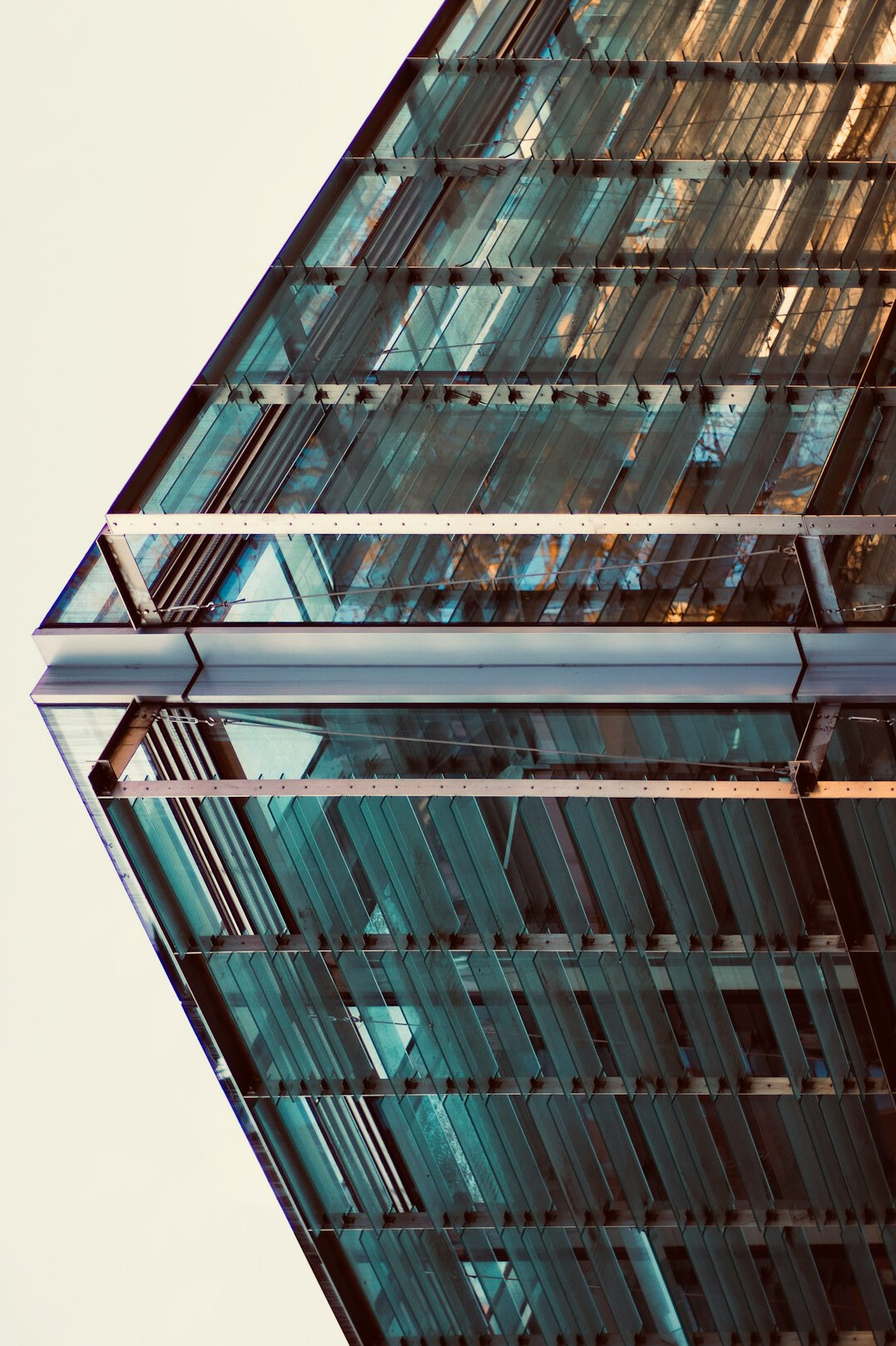 Modern glass office building seen from below